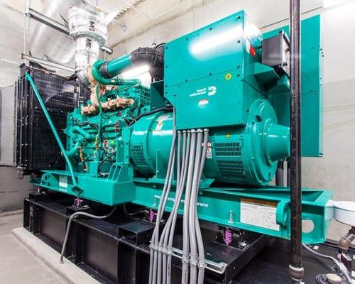 Photo from inside the central energy plant. Aqua colored generator.